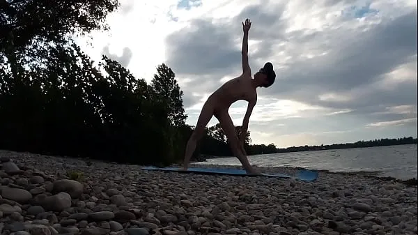 Skinny naturist twink practices naked yoga on a nudist beach Filem baharu